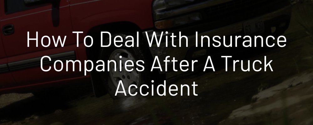 Dealing with insurance companies after a truck accident. Red truck driving.