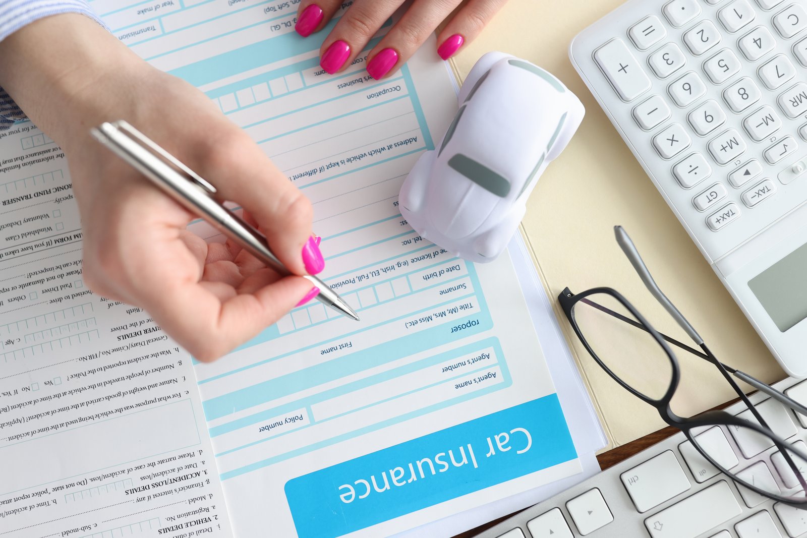 Insurance paperwork and a calculator used to estimate a settlement reserve for a claim