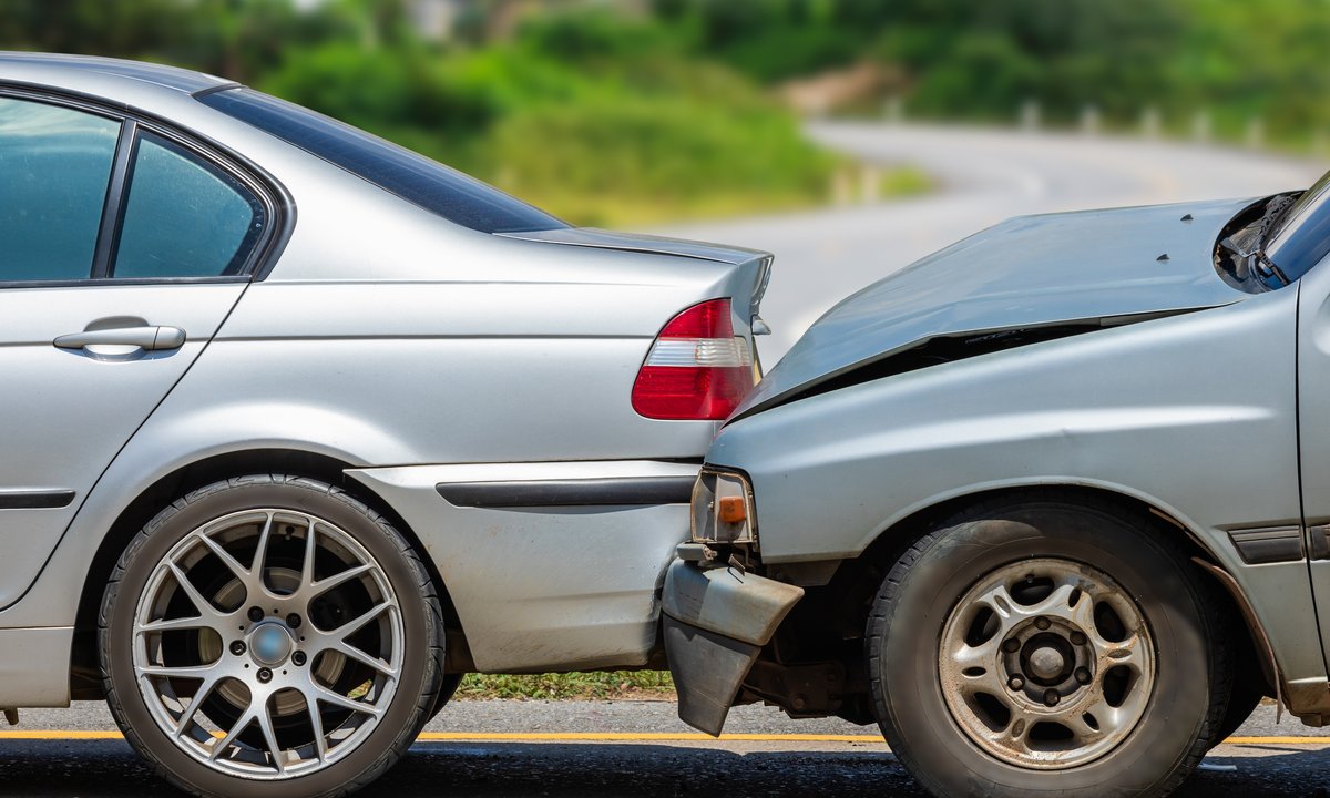 Two cars involved in a minor fender bender accident on the road